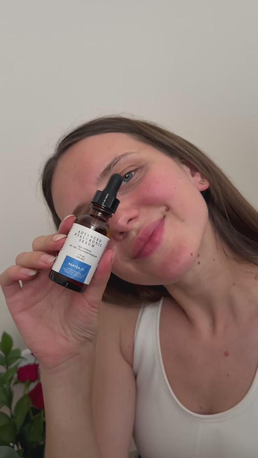 Video of woman applying Advanced Hyaluronic Serum, Pantea MD Anti Aging Serum for Face on cheeks, forehead, and hand